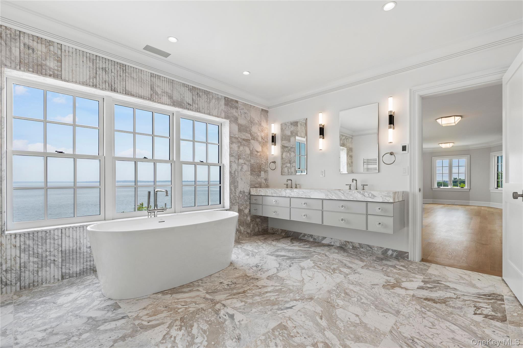 104 Premium Point Larchmont, NY 10538 - Photo 23 of 36 a large bathroom with a bathtub and a sink