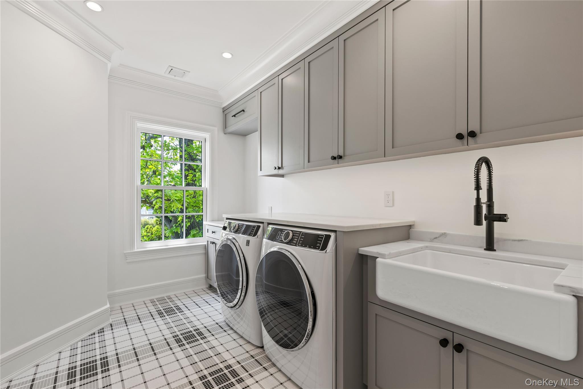 104 Premium Point Larchmont, NY 10538 - Photo 26 of 41 a utility room with sink dryer and washer