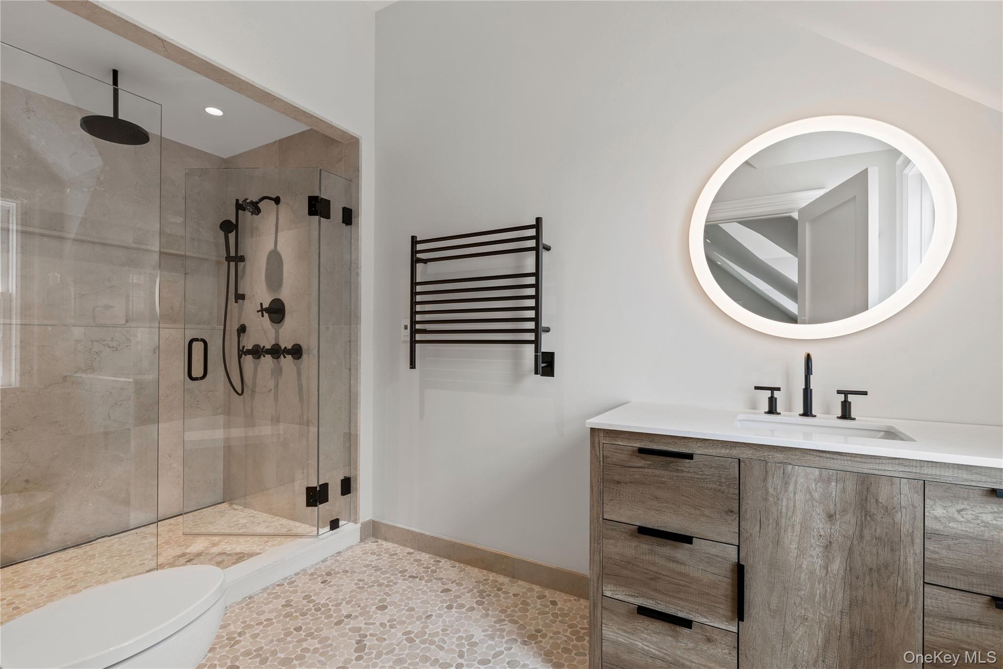 104 Premium Point Larchmont, NY 10538 - Photo 28 of 36 a bathroom with a sink a toilet and shower