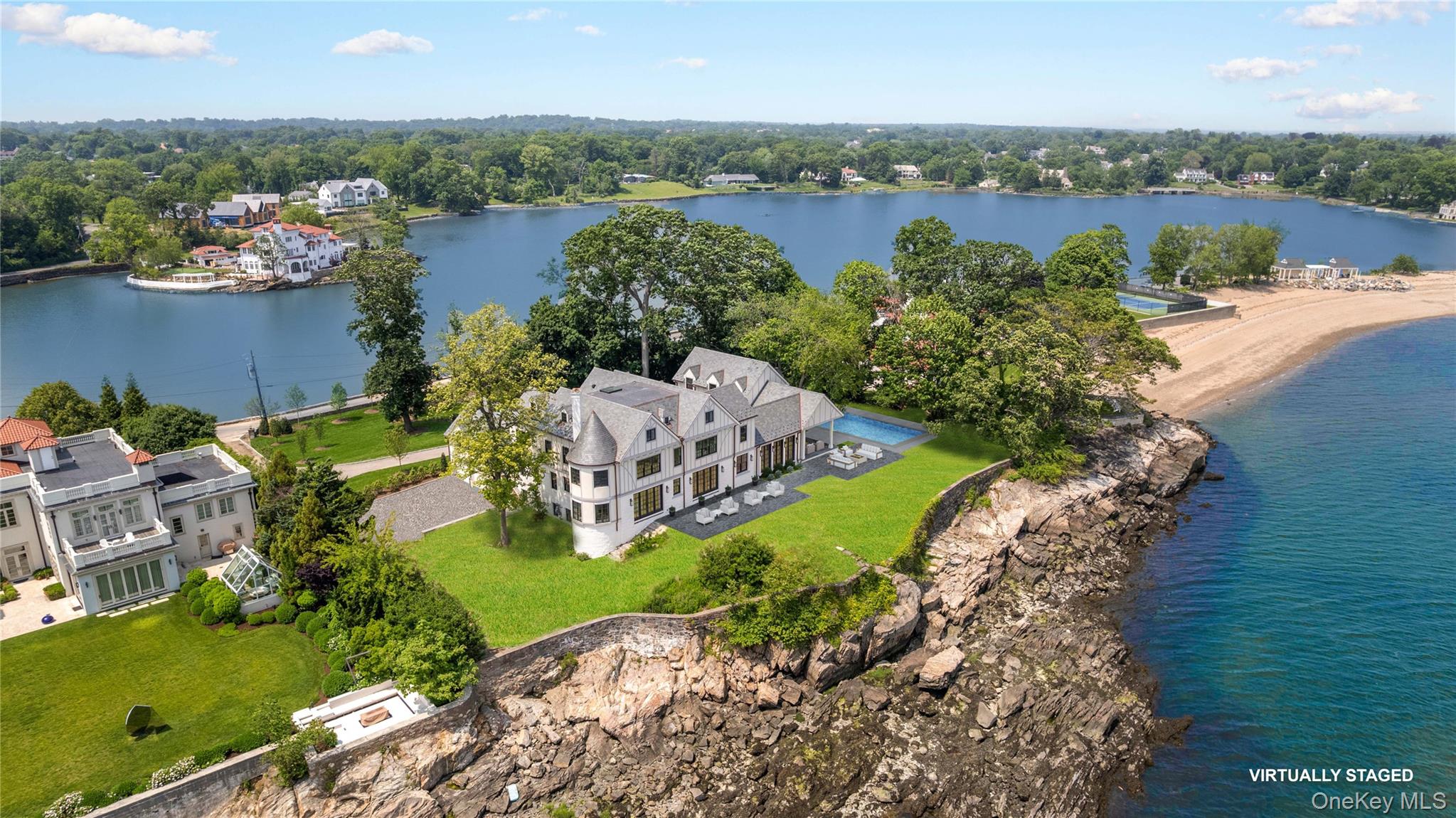 104 Premium Point Larchmont, NY 10538 - Photo 3 of 36 an aerial view of a house with outdoor space and lake view