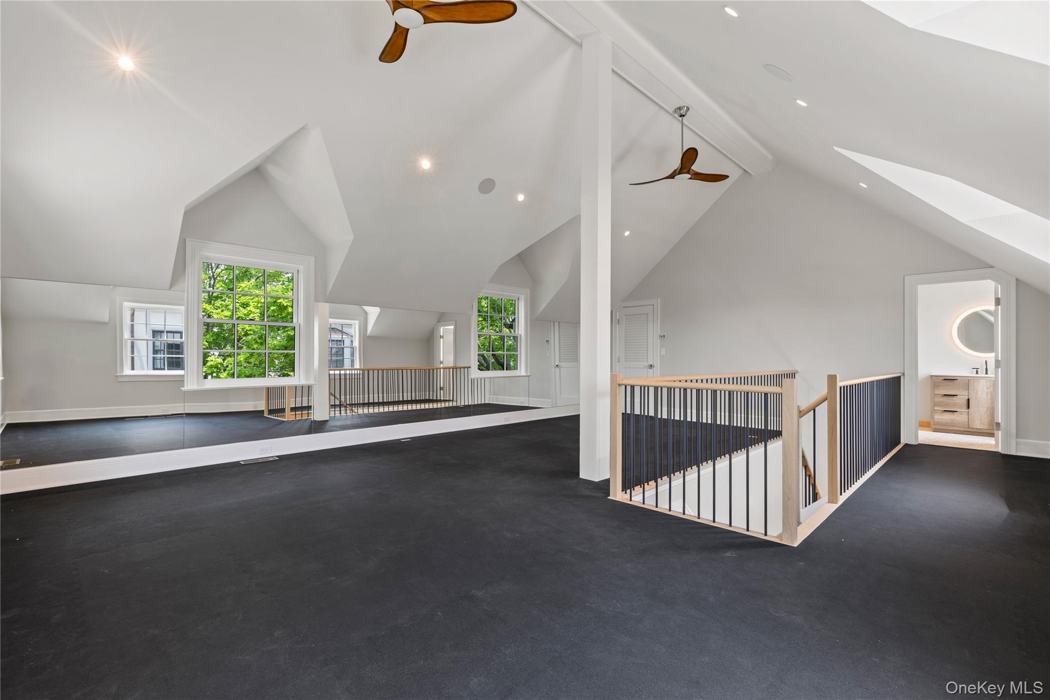 104 Premium Point Larchmont, NY 10538 - Photo 31 of 41 an empty room with windows and stairs