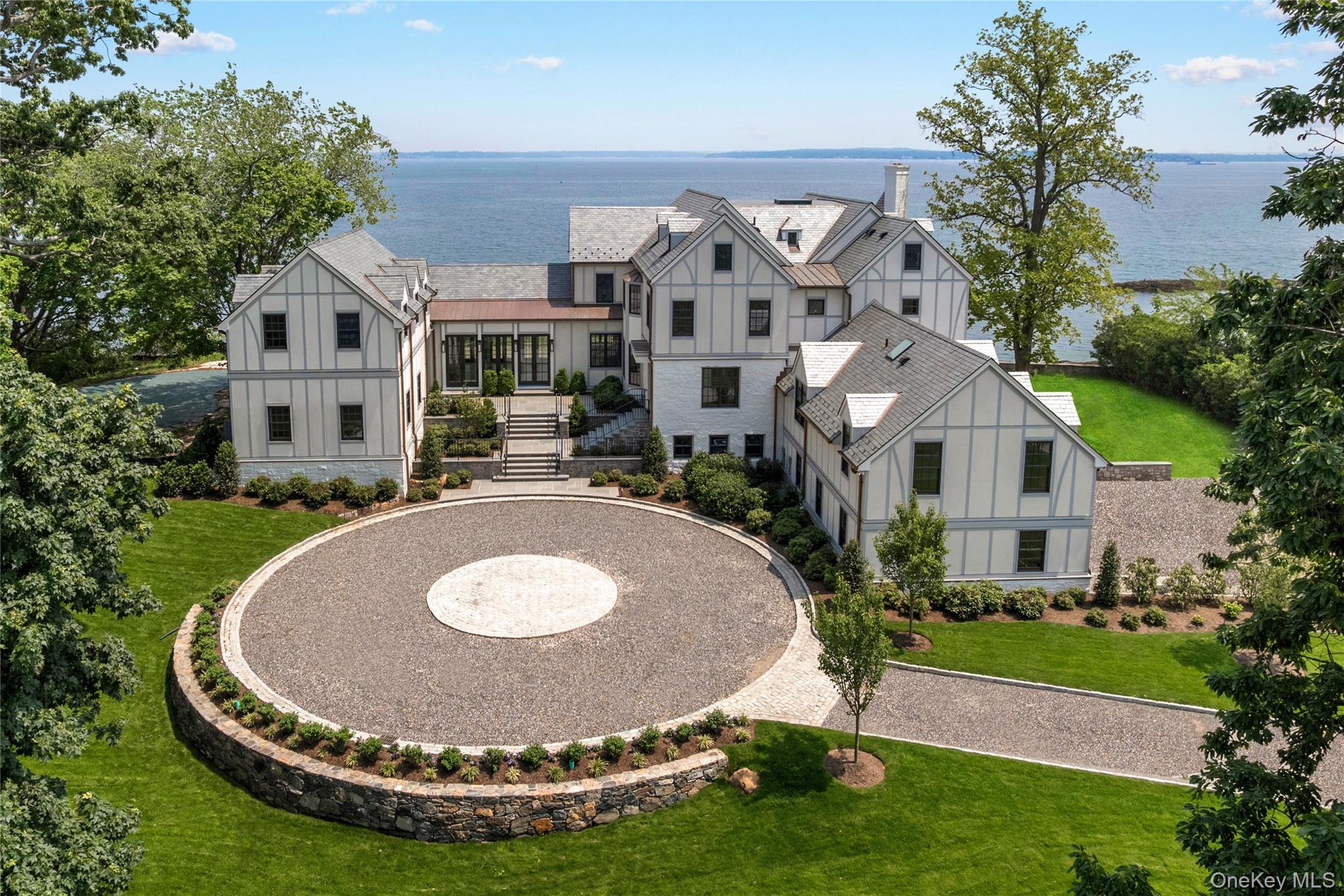 104 Premium Point Larchmont, NY 10538 - Photo 32 of 36 a view of a house with backyard and a garden
