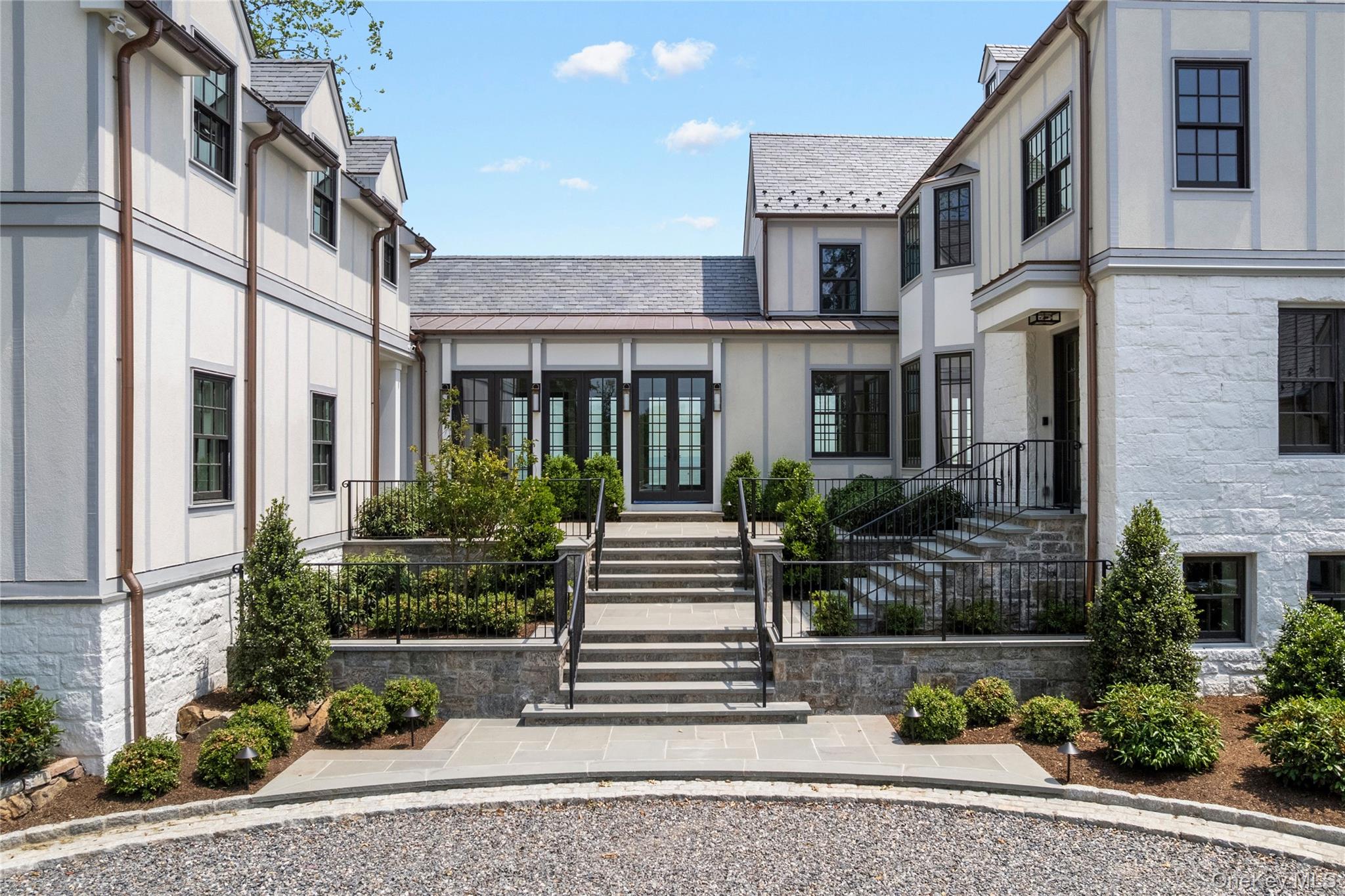 104 Premium Point Larchmont, NY 10538 - Photo 5 of 36 a front view of a house with a garden