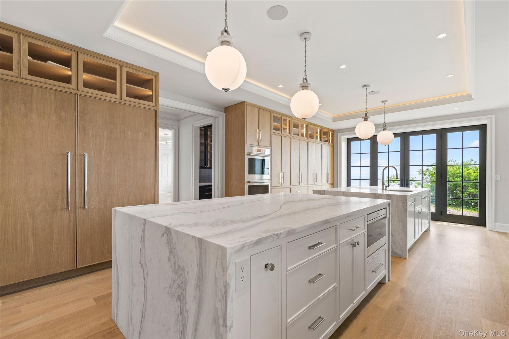 104 Premium Point Larchmont, NY 10538 - Photo 6 of 36 a large kitchen with kitchen island a large island in it