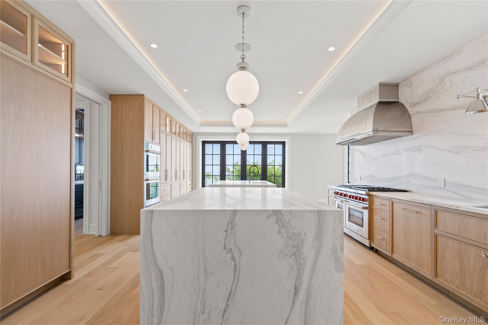 104 Premium Point Larchmont, NY 10538 - Photo 8 of 36 a large kitchen with stainless steel appliances granite countertop a stove and a large window