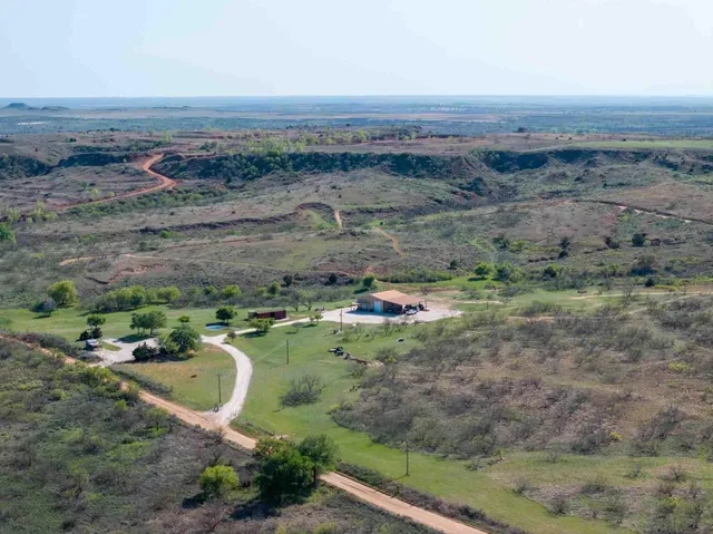 an aerial view of a house with a outdoor space