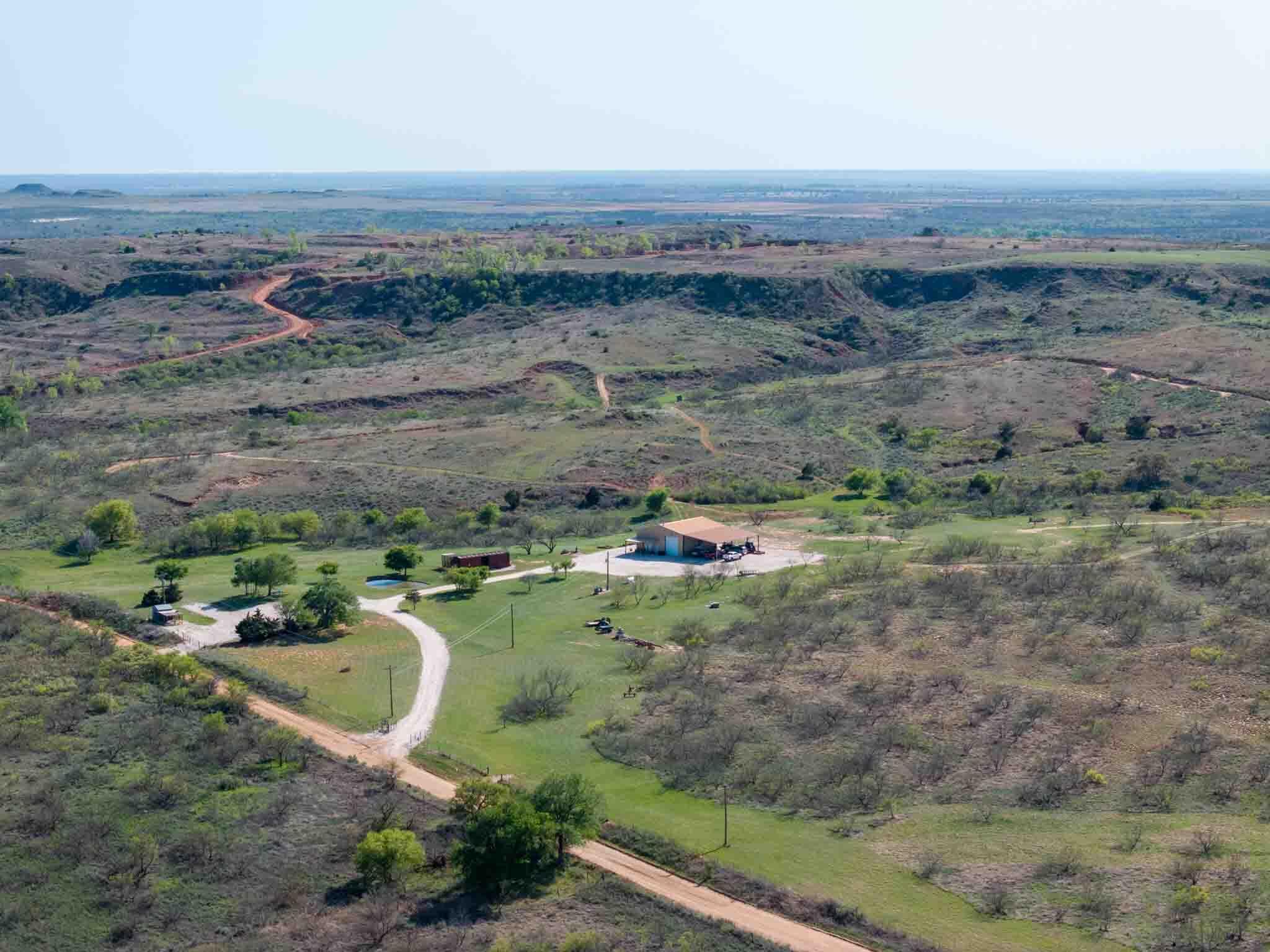 an aerial view of a house with a outdoor space