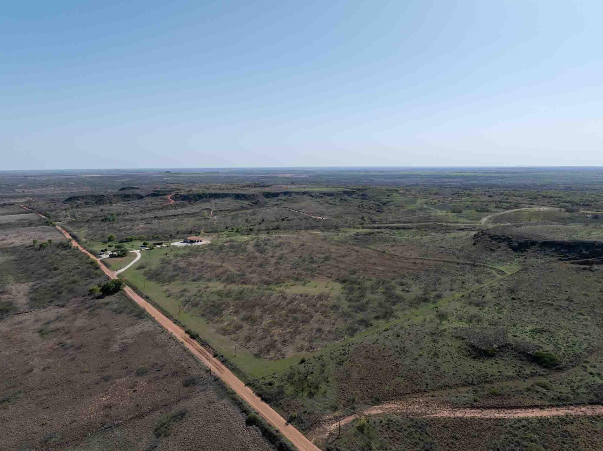 140 Mm Ranch Shamrock, TX 79079 - Photo 3 of 76 a view of a dry yard with wooden floor and fence