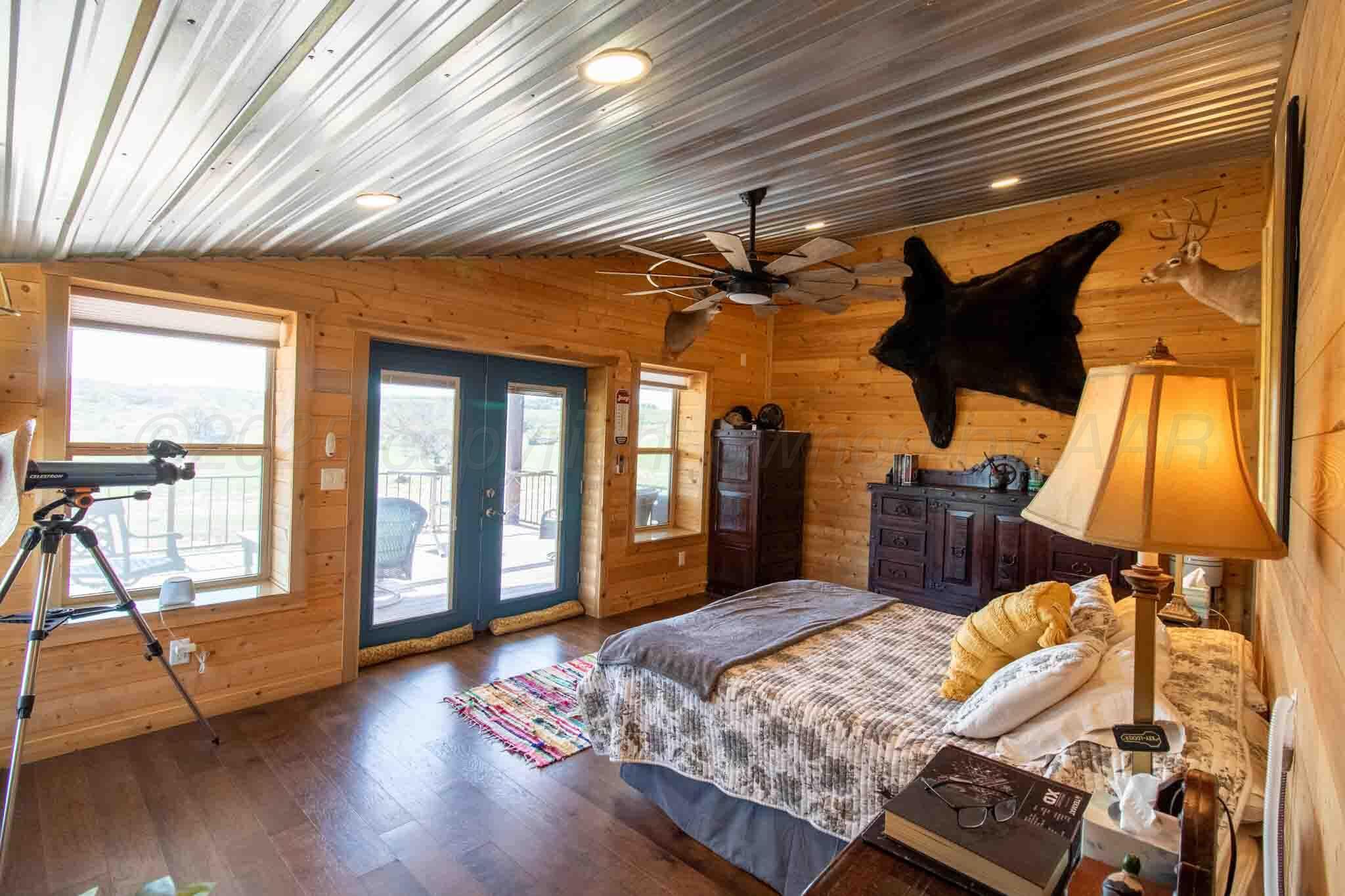 140 Mm Ranch Shamrock, TX 79079 - Photo 32 of 76 a bed sitting in a bedroom next to a window