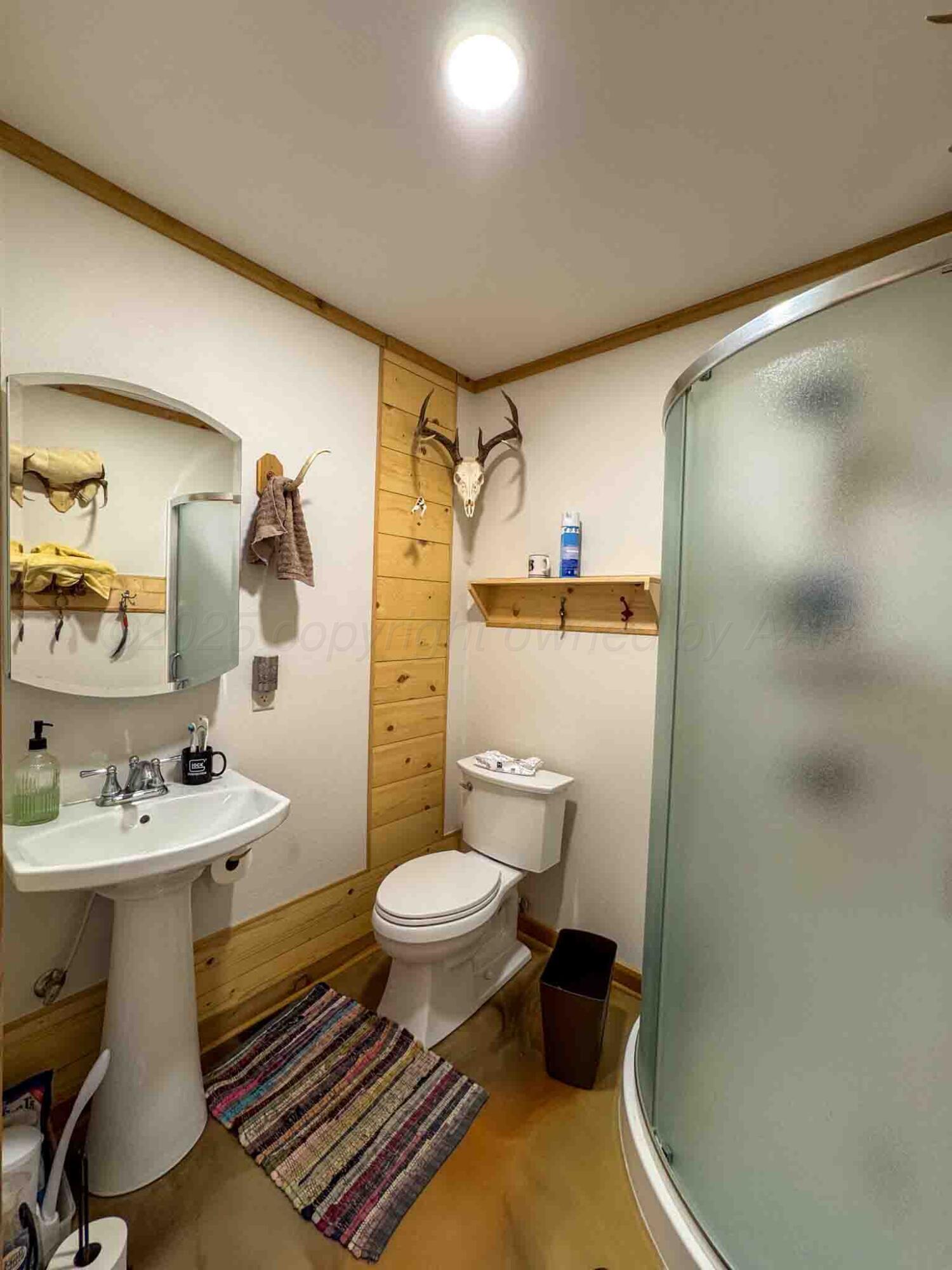 140 Mm Ranch Shamrock, TX 79079 - Photo 34 of 76 a bathroom with a sink toilet and shower