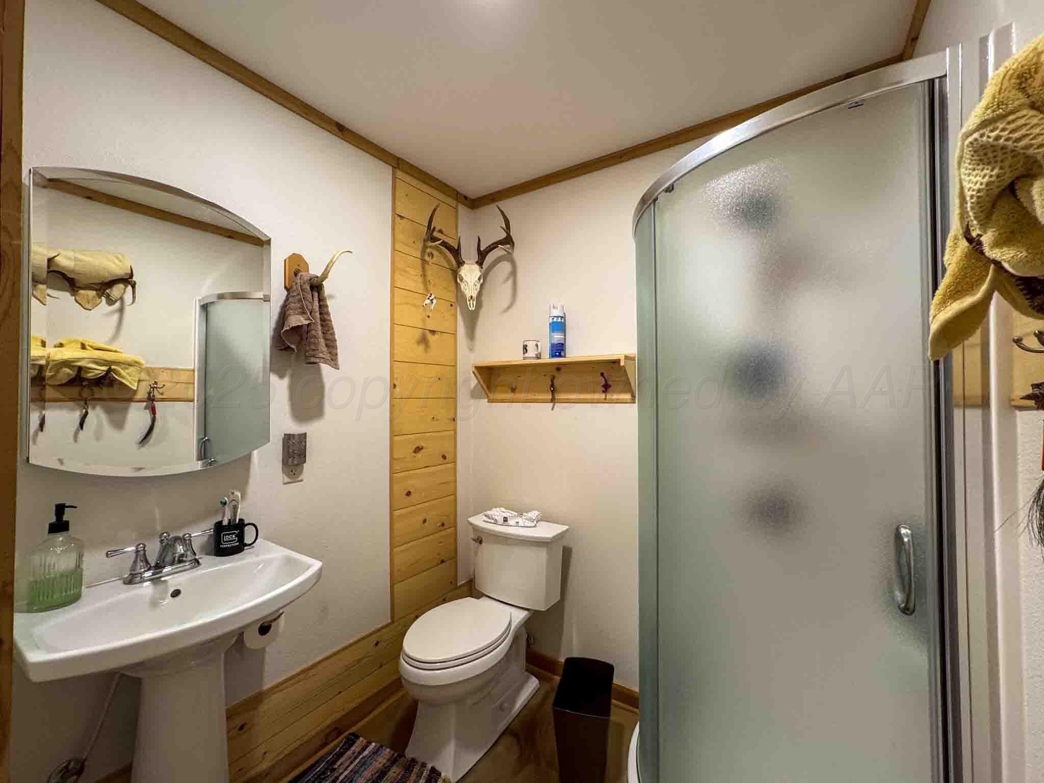 140 Mm Ranch Shamrock, TX 79079 - Photo 37 of 76 a bathroom with a sink toilet and shower