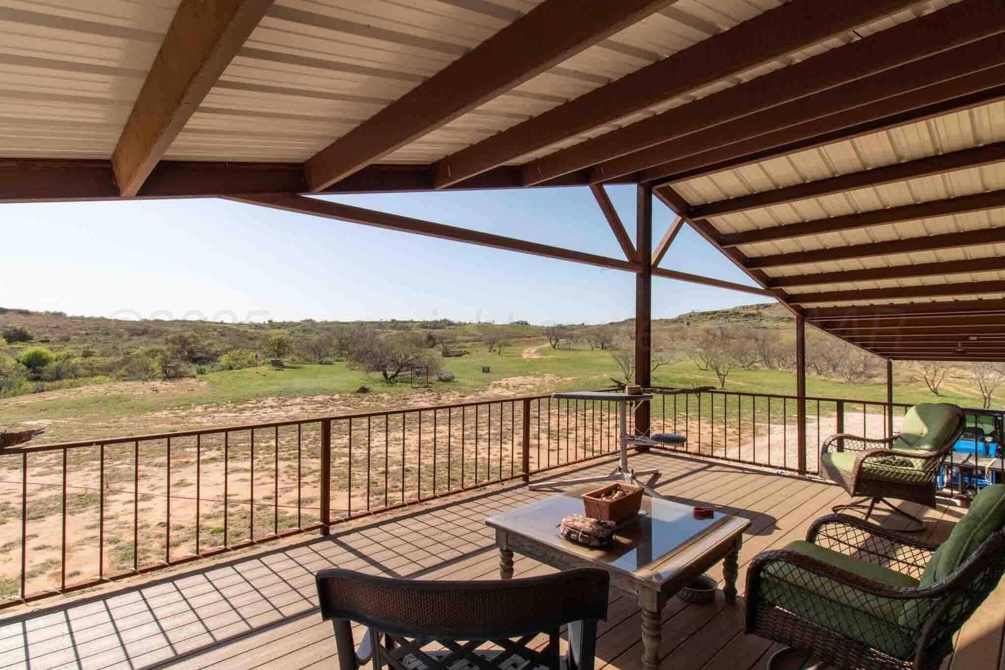 140 Mm Ranch Shamrock, TX 79079 - Photo 38 of 76 a view of a balcony with chairs and wooden floor