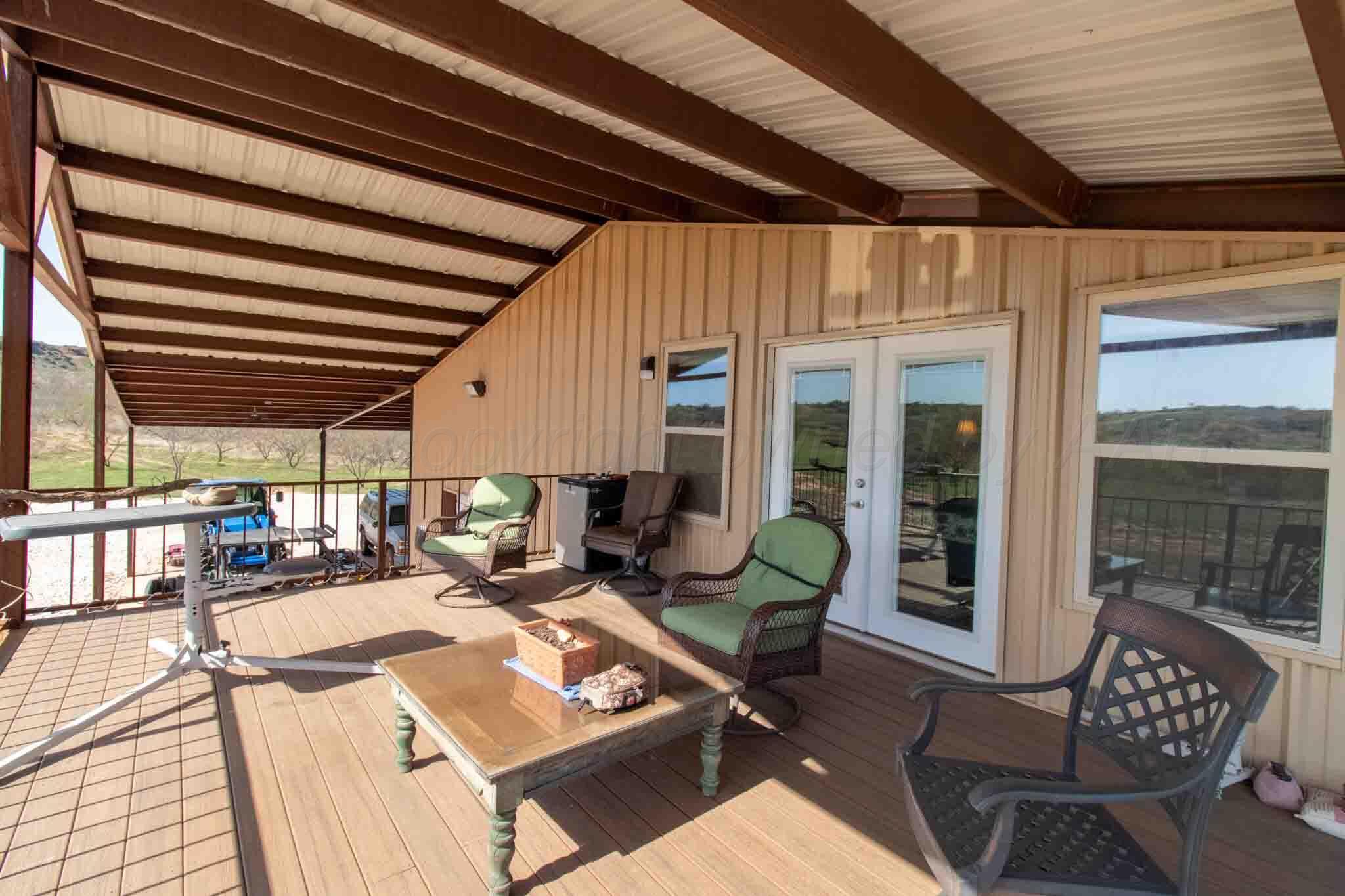 140 Mm Ranch Shamrock, TX 79079 - Photo 39 of 76 a living room with a couch a table and chairs
