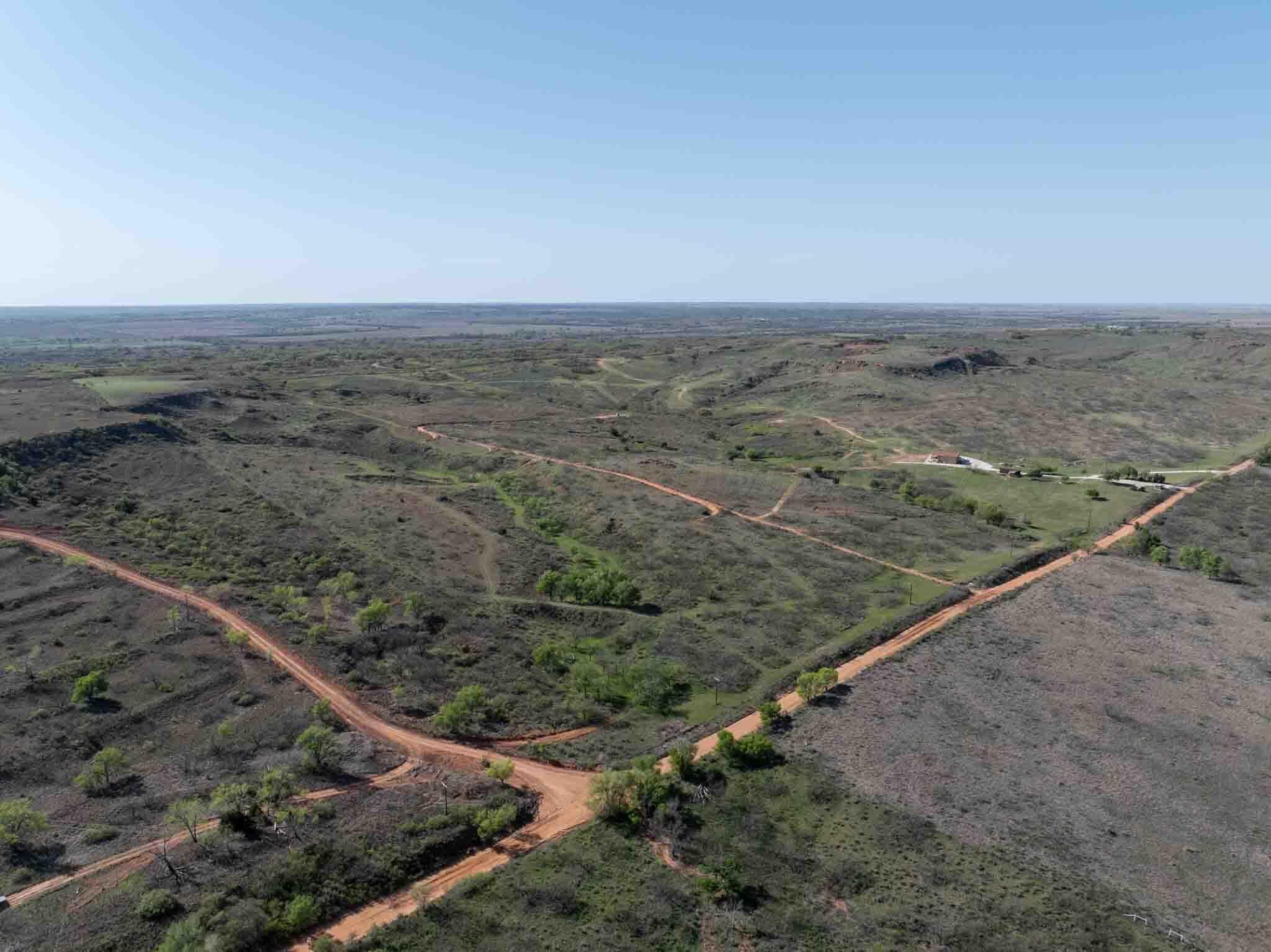 140 Mm Ranch Shamrock, TX 79079 - Photo 6 of 76 a view of a dry yard with wooden floor and fence