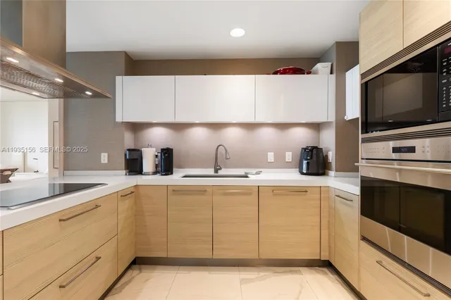 a kitchen with a sink stove and microwave