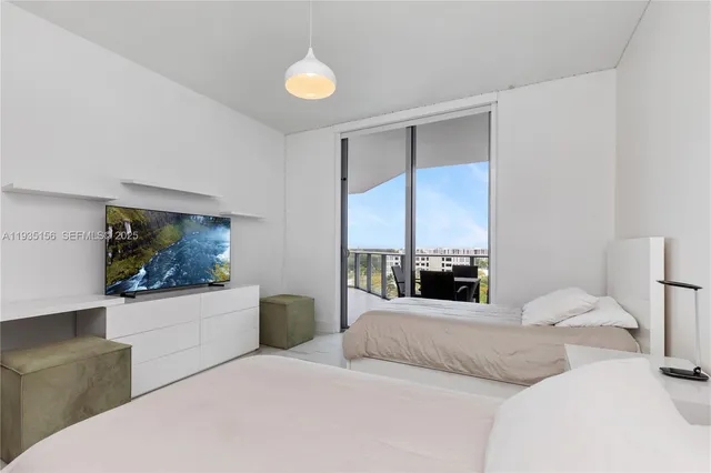 a bedroom with a bed and a couch