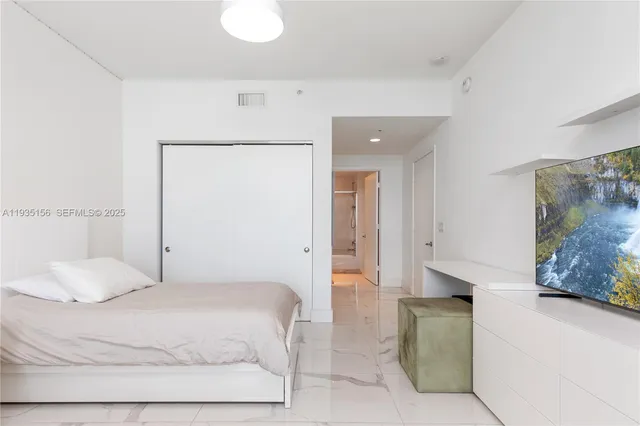 a bathroom with a toilet a sink and a mirror