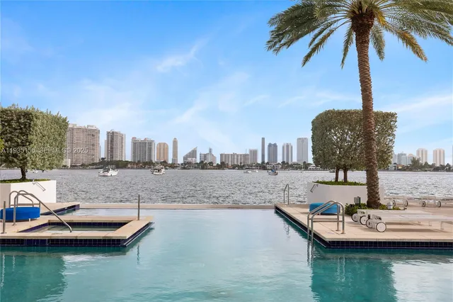 a living room with furniture and large windows