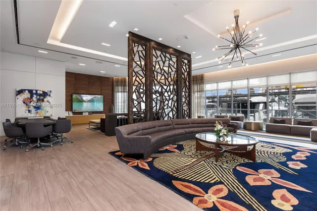 a front view of multi story residential apartment building with yard and sign board