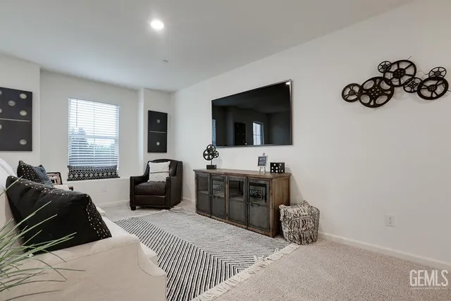 a bedroom with furniture and flat screen tv