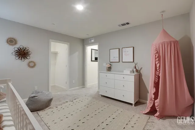 a bedroom with a bed and a closet