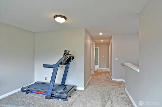 a bathroom with a granite countertop sink a mirror a bathtub and shower