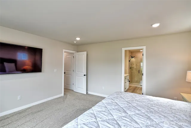 a bedroom with a bed and a lamp