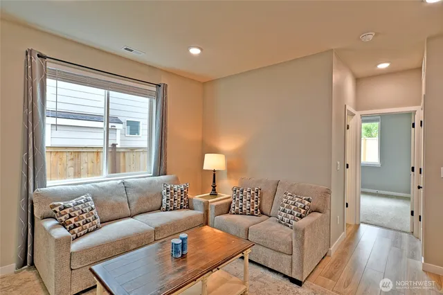 a living room with furniture and a table