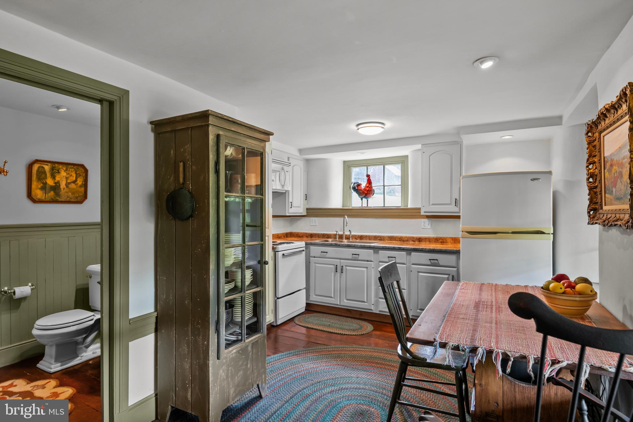 139 Mine Road Oley, PA 19547 - Photo 44 of 86 a kitchen with stainless steel appliances granite countertop a stove top oven a sink a dining table and chairs