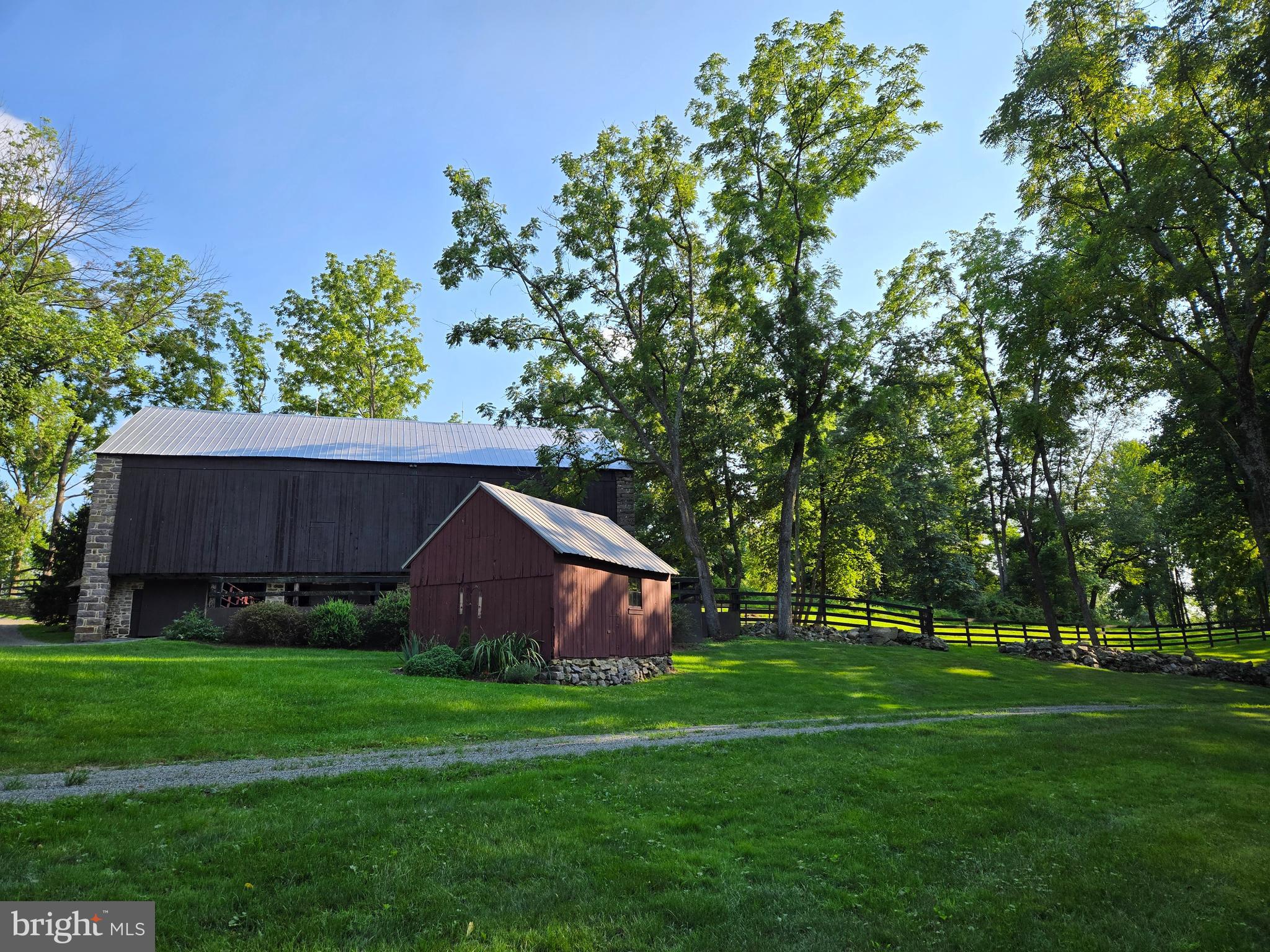 139 Mine Road Oley, PA 19547 - Photo 70 of 86 a view of a backyard with large trees and wooden fence