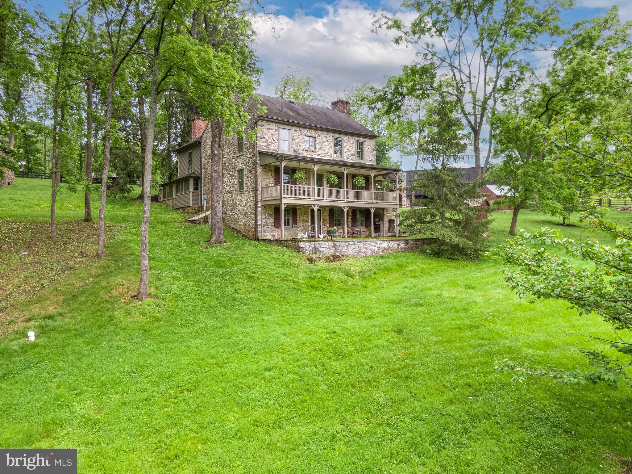139 Mine Road Oley, PA 19547 - Photo 7 of 86 a view of a house with a big yard and large trees