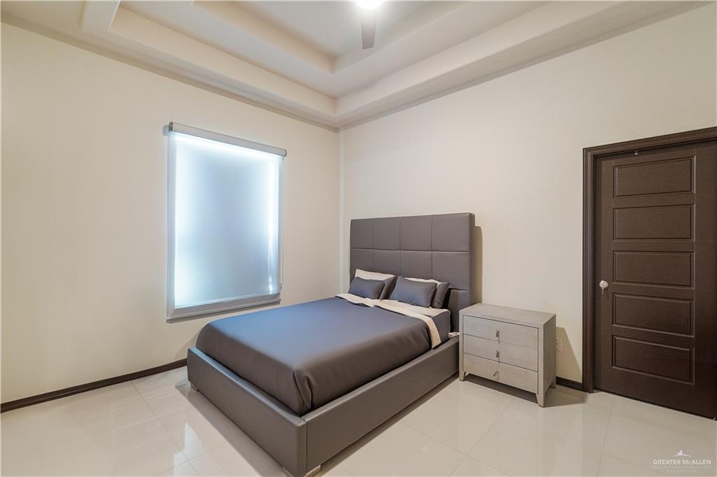 3104 Santa Monica Mission, TX 78572 - Photo 20 of 26 a bedroom with a bed and cabinet