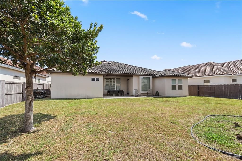 3104 Santa Monica Mission, TX 78572 - Photo 24 of 26 a view of a house with a yard and garage