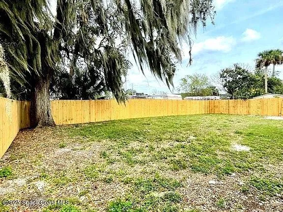 a view of a swimming pool with an outdoor space and seating area