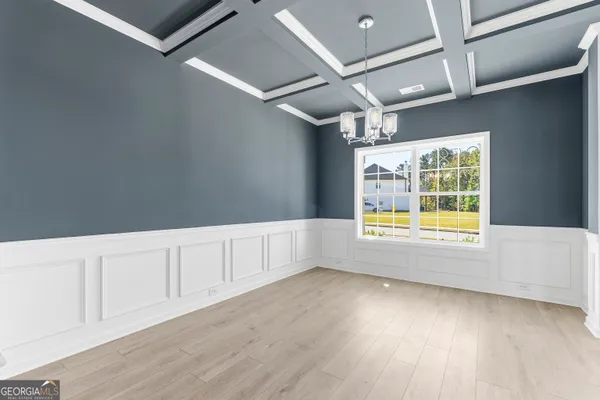 a view of a livingroom with wooden floor