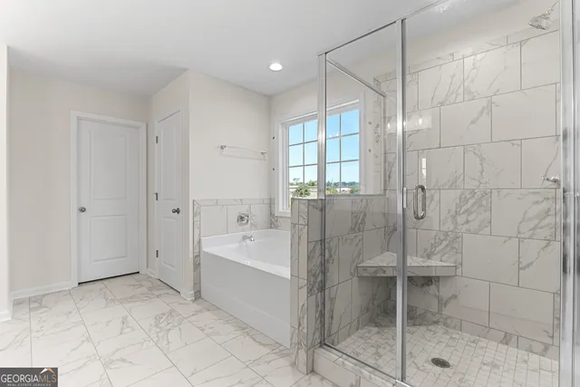 a view of a house with a yard and garage