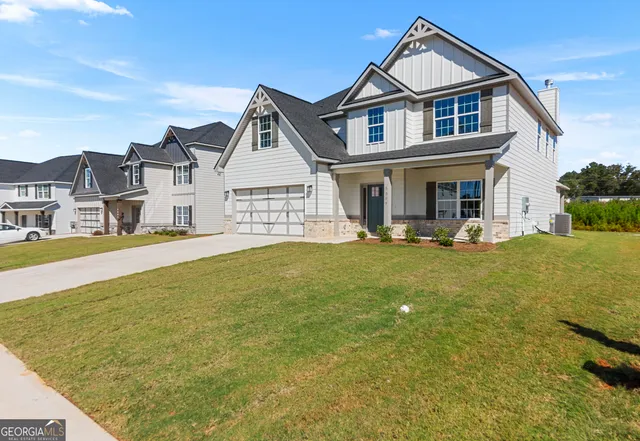 a front view of a house with swimming pool