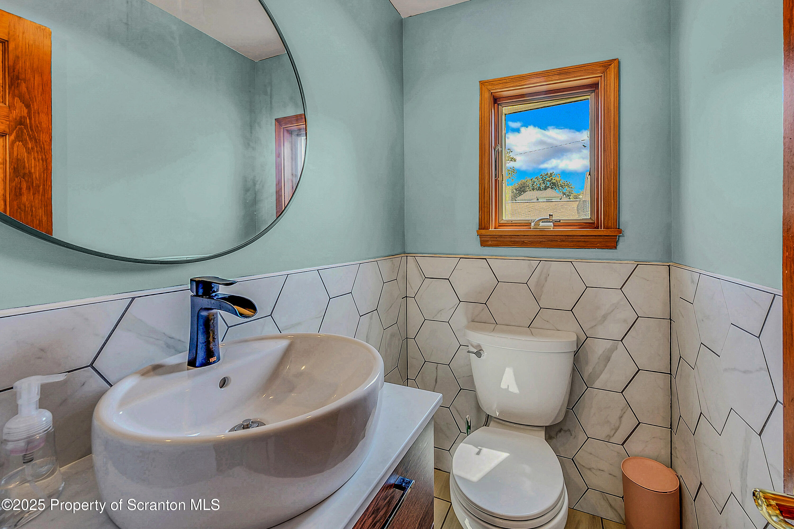 505 Main Avenue Clarks Summit, PA 18411 - Photo 19 of 76 a bathroom with a toilet sink and mirror