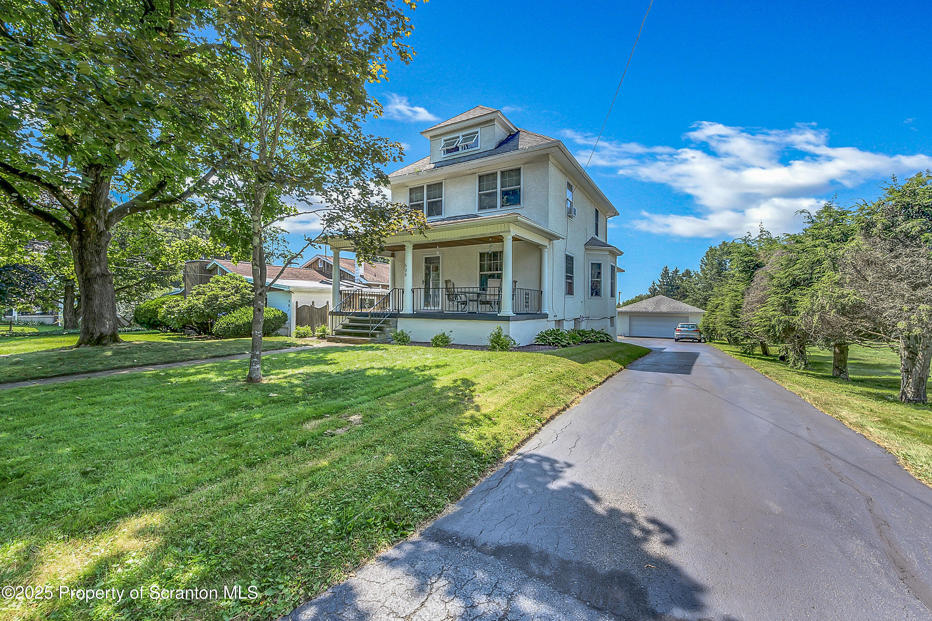 505 Main Avenue Clarks Summit, PA 18411 - Photo 2 of 76 a front view of a house with garden