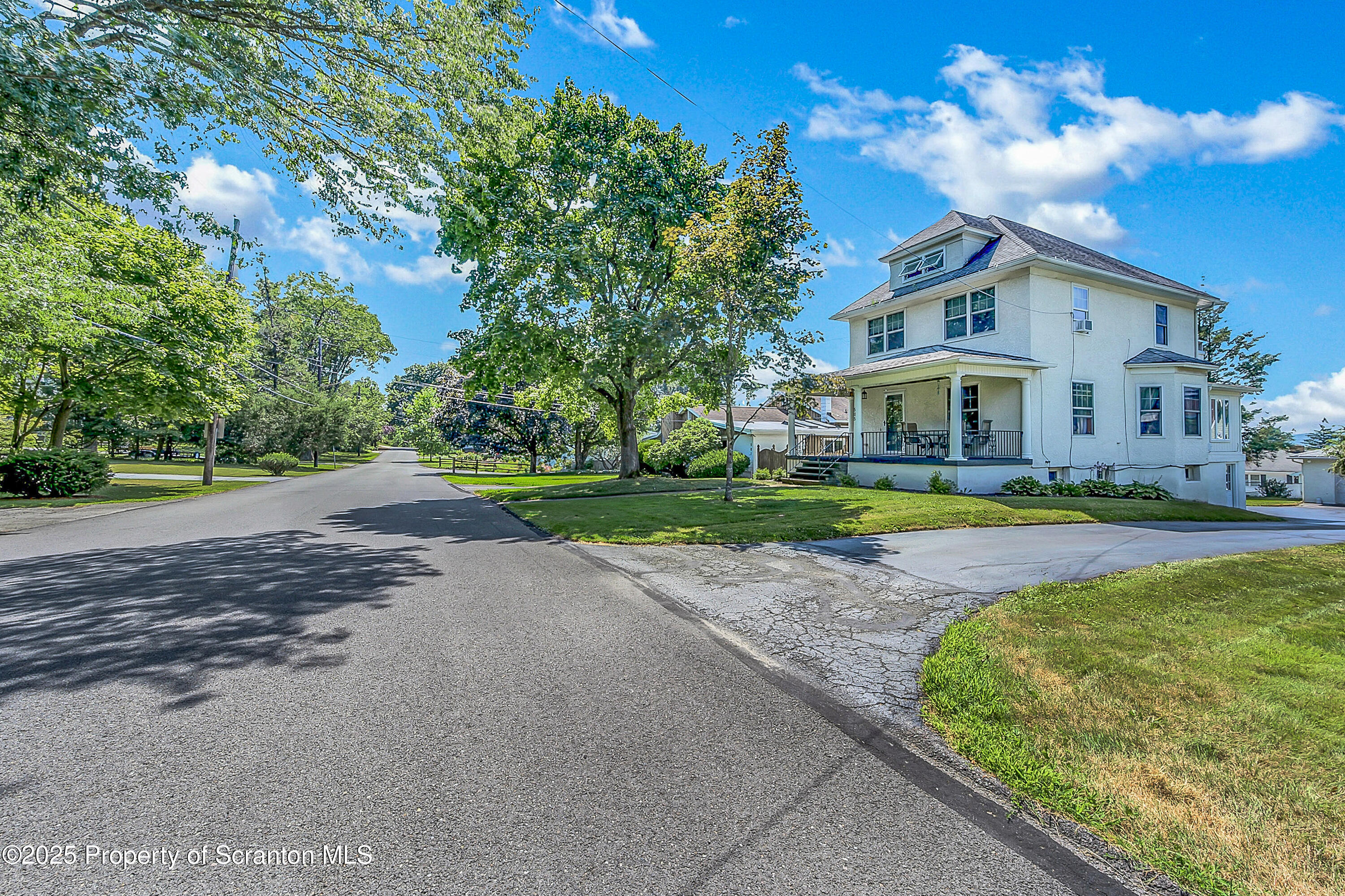 505 Main Avenue Clarks Summit, PA 18411 - Photo 3 of 76 a view of a house with a big yard plants and large trees