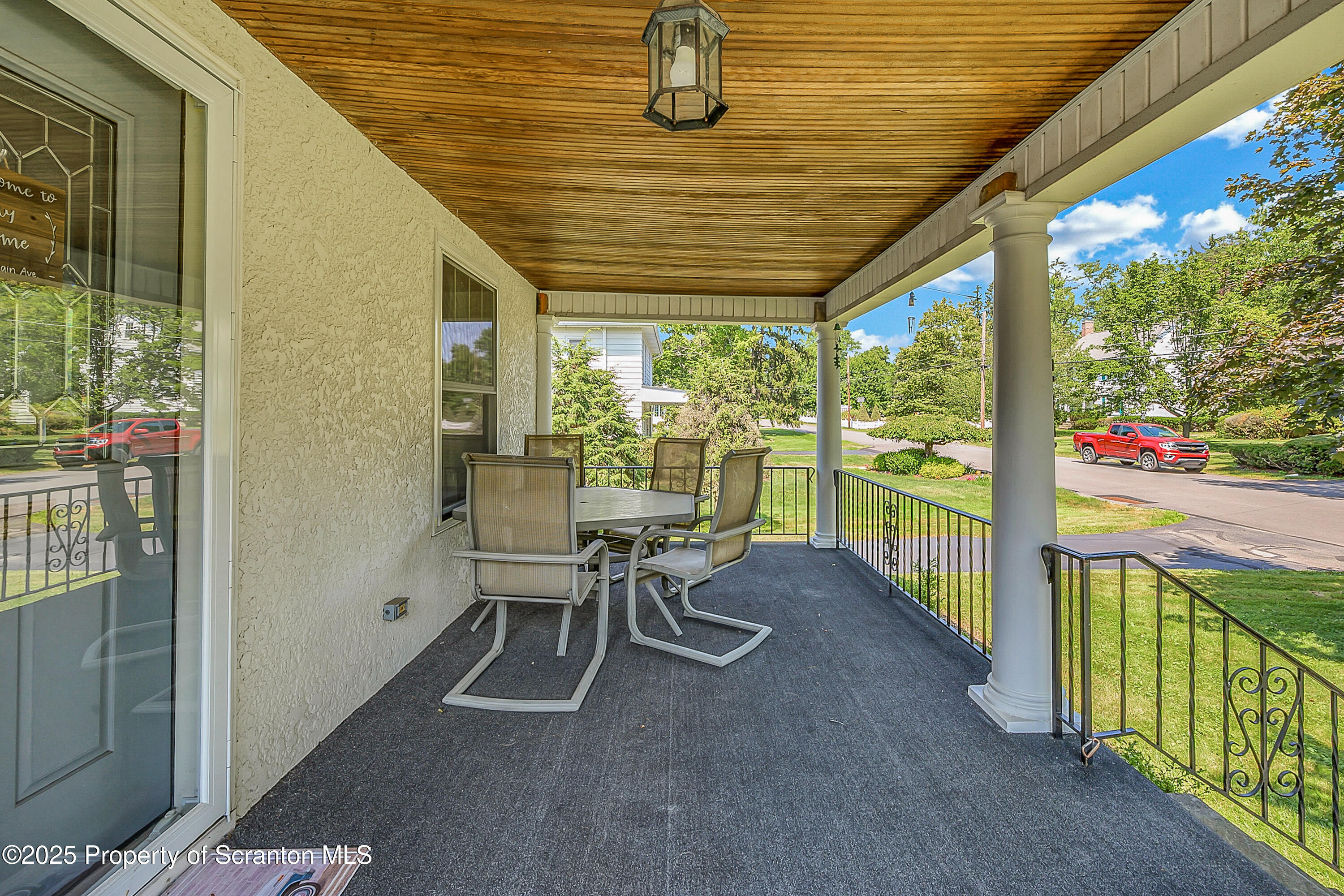 505 Main Avenue Clarks Summit, PA 18411 - Photo 9 of 76 a view of a patio with table and chairs and floor to ceiling window