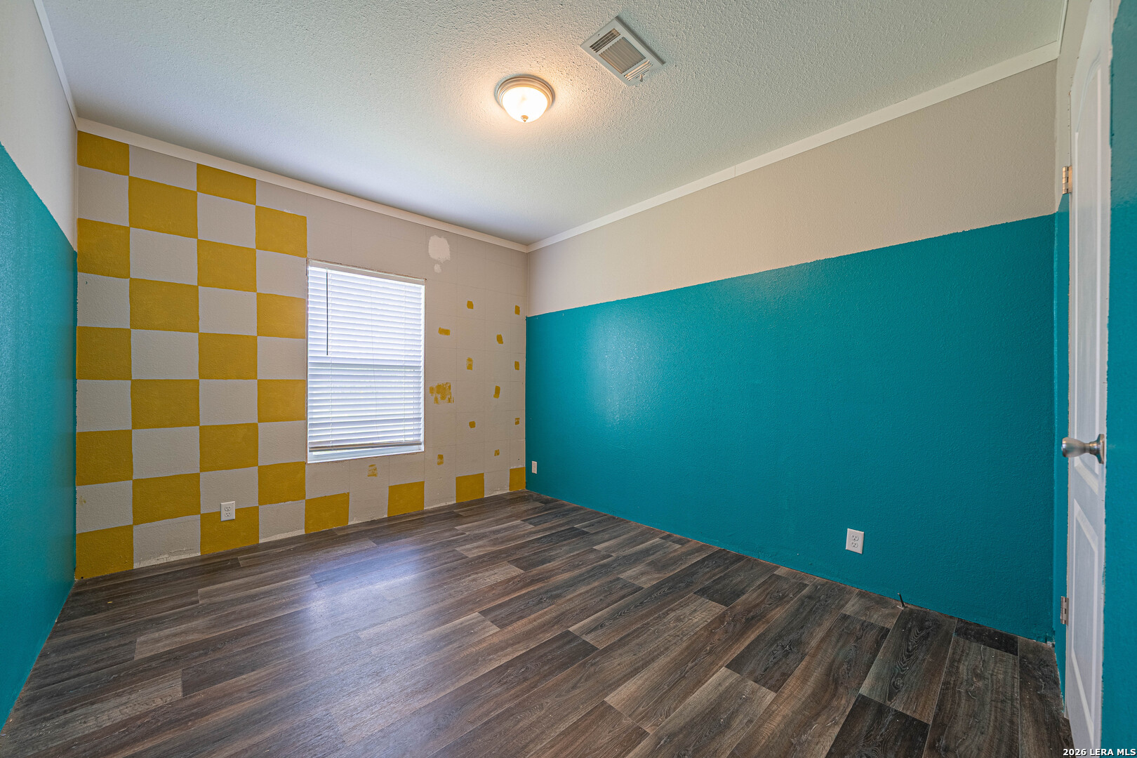 3433 Gander Slough Road Kingsbury, TX 78638 - Photo 16 of 23 a view of an empty room with wooden floor and a window
