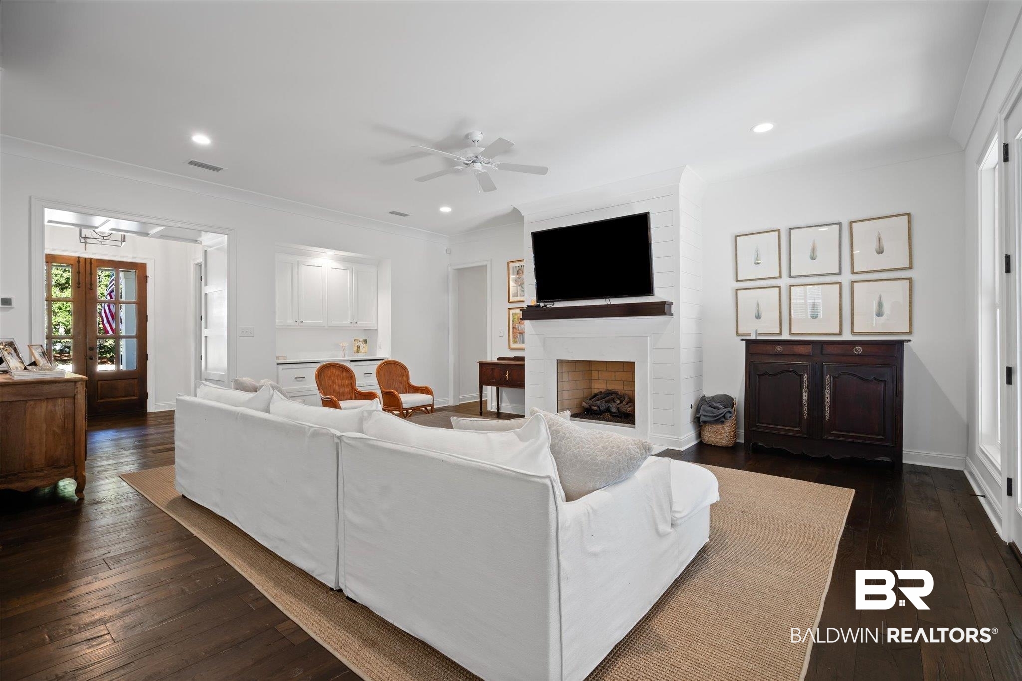 3713 Old Shell Road Mobile, AL 36608 - Photo 15 of 52 Living room with crown molding, ceiling fan, a fireplace, and dark wood-type flooring
