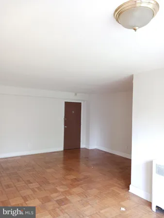 a view of a roof deck with table and chairs a barbeque with wooden floor and fence