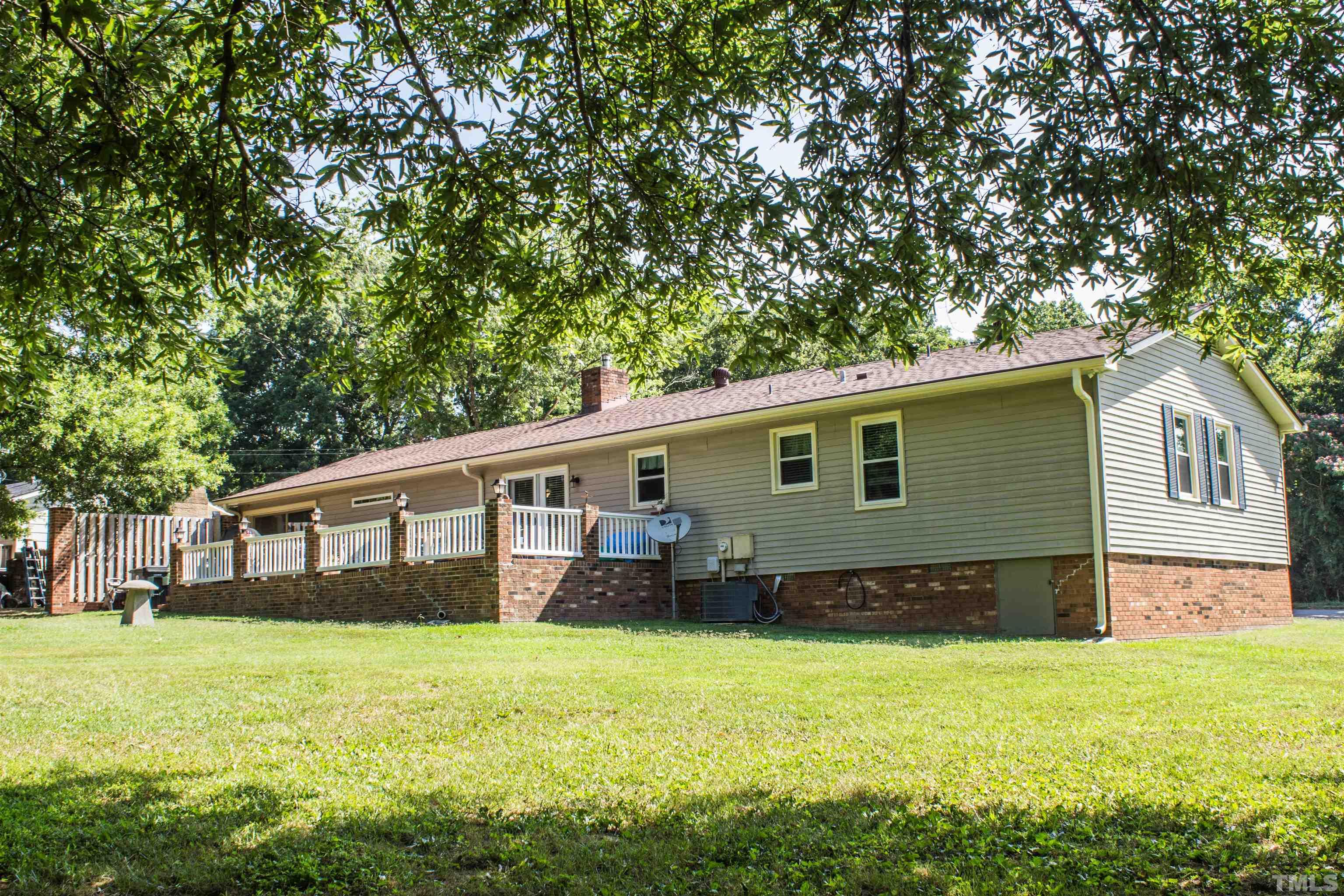 2102 Snow Hill Road Durham, NC 27712 - Photo 13 of 15 a house view with a garden space