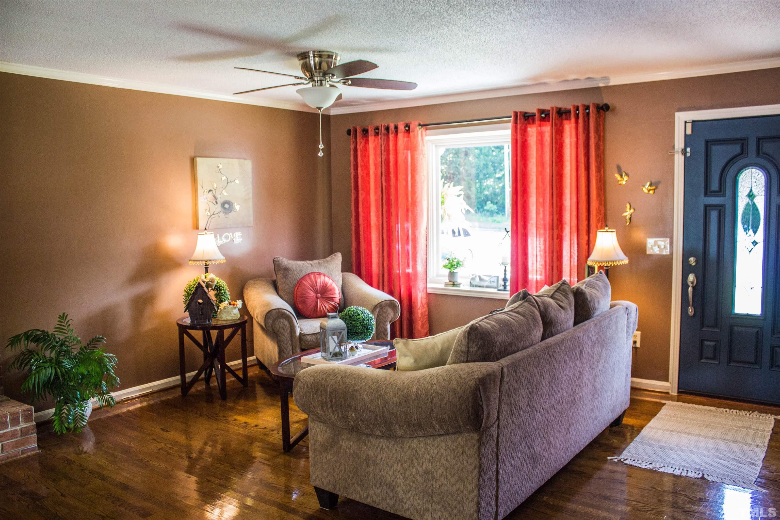 2102 Snow Hill Road Durham, NC 27712 - Photo 5 of 15 a living room with furniture and a large window