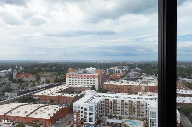 an empty room with sliding glass door and windows