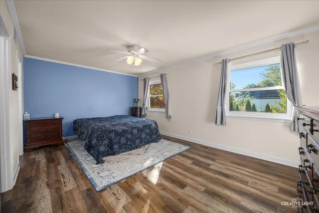 a living room with a bed furniture and a window