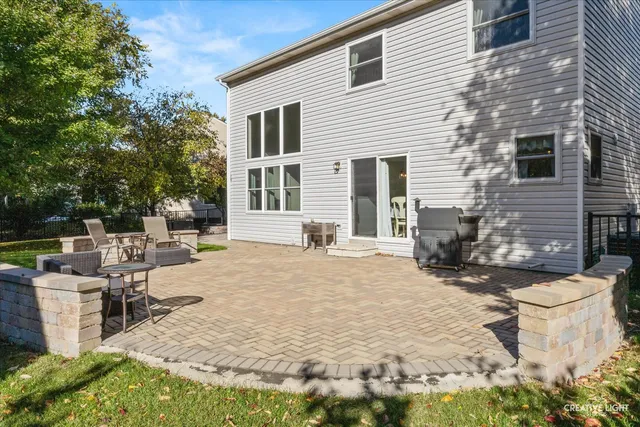 a view of a backyard with sitting area