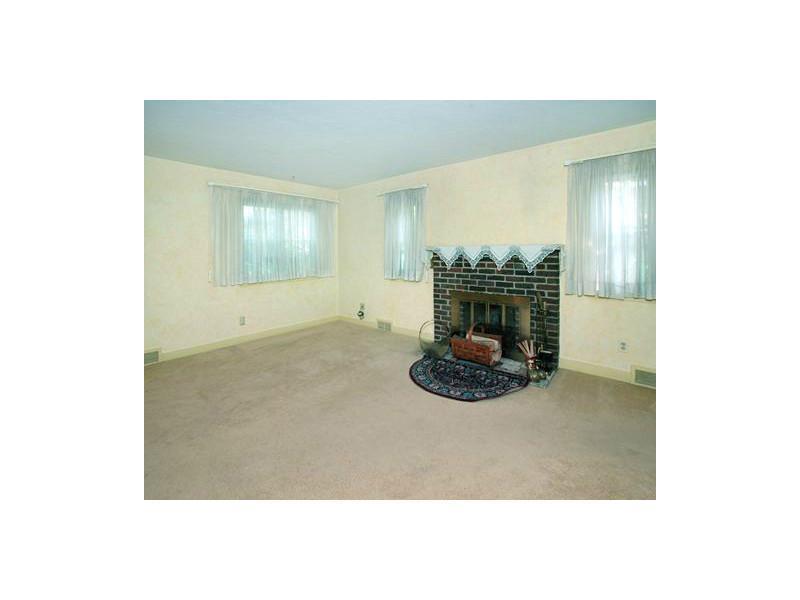 Living Room. Log-burning fireplace is a great spot for sitting to get warm on those cold winter nights!